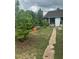 View of the property's backyard with natural landscaping at 7625 Jarvis Ct, Orlando, FL 32818