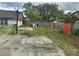 View of the property's backyard with a concrete area at 7625 Jarvis Ct, Orlando, FL 32818