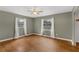 Sunny bedroom with hardwood floors and plenty of natural light at 826 S Montgomery Ave, Deland, FL 32720