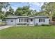 Charming single-story home featuring a well-maintained lawn and neutral color palette at 826 S Montgomery Ave, Deland, FL 32720
