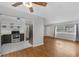 Open-concept living room boasts hardwood floors and an eat-in kitchen at 826 S Montgomery Ave, Deland, FL 32720