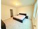 Neutral bedroom featuring a large bed with two nightstands and plush carpet at 877 Rivers Crossings St, Clermont, FL 34714