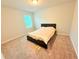 Comfortable bedroom with a bed and carpet, offering a cozy and inviting space at 877 Rivers Crossings St, Clermont, FL 34714