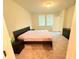 Spacious bedroom with a bed and dresser, neutral walls, and carpeted floors at 877 Rivers Crossings St, Clermont, FL 34714