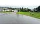 Charming two-story home with a two-car garage and brick-paved driveway on a lush green lot at 877 Rivers Crossings St, Clermont, FL 34714