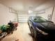 Spacious garage with a car and ample storage space at 877 Rivers Crossings St, Clermont, FL 34714