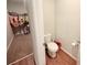 Powder room with tile floors and a view into a walk-in closet at 877 Rivers Crossings St, Clermont, FL 34714
