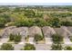 Aerial view of a desirable neighborhood near the city showcasing mature trees and well-maintained homes at 886 Sherbourne Cir, Lake Mary, FL 32746