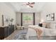 Comfortable bedroom features a large window with natural light and a decorative rug at 886 Sherbourne Cir, Lake Mary, FL 32746