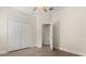 Bedroom with a ceiling fan, closet, and entry to the hallway at 886 Sherbourne Cir, Lake Mary, FL 32746