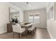 Contemporary dining room featuring a stylish table, modern lighting, and ample space for entertaining guests at 886 Sherbourne Cir, Lake Mary, FL 32746