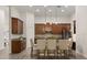 Kitchen with dark wood cabinets, granite counters, and stainless steel appliances at 886 Sherbourne Cir, Lake Mary, FL 32746