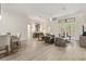 Bright living room with tile floors, neutral walls, and large sliding doors to the outside patio at 886 Sherbourne Cir, Lake Mary, FL 32746