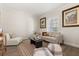 Cozy and serene living room featuring neutral decor and comfortable seating perfect for relaxing and entertaining at 886 Sherbourne Cir, Lake Mary, FL 32746