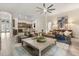 Open-concept living room with tile flooring, comfortable seating, and views into the kitchen at 886 Sherbourne Cir, Lake Mary, FL 32746