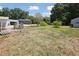 Large backyard view showcasing the vast green space, perfect for outdoor activities and recreation at 949 Shadow Oaks Rd, Kissimmee, FL 34744