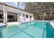 Luminous pool with a screen, attached to the house, offering a private outdoor retreat with access to the home at 949 Shadow Oaks Rd, Kissimmee, FL 34744