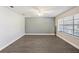 Spacious bedroom featuring modern laminate flooring and large window at 949 Shadow Oaks Rd, Kissimmee, FL 34744
