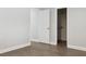 Neutral bedroom with hardwood floors and a walk-in closet at 949 Shadow Oaks Rd, Kissimmee, FL 34744