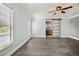 Bedroom features natural light, and modern barn door with tile floors at 949 Shadow Oaks Rd, Kissimmee, FL 34744