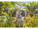 A decorative water feature adds charm to this home's garden at 949 Shadow Oaks Rd, Kissimmee, FL 34744