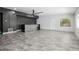 Spacious living room with modern lighting, a tile bar, and stylish flooring at 949 Shadow Oaks Rd, Kissimmee, FL 34744