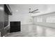 Bright living room features neutral walls, modern fan, and sleek tile flooring at 949 Shadow Oaks Rd, Kissimmee, FL 34744