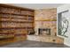 Charming living area featuring a brick fireplace with wooden shelves and a vintage art-glass window at 949 Shadow Oaks Rd, Kissimmee, FL 34744