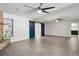 Spacious living room with barn doors, fireplace and ceiling fans at 949 Shadow Oaks Rd, Kissimmee, FL 34744