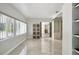 Spacious main bedroom with large window, tile floors, and custom storage at 949 Shadow Oaks Rd, Kissimmee, FL 34744