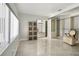 Bright main bedroom with natural light, modern storage, and tile floors at 949 Shadow Oaks Rd, Kissimmee, FL 34744
