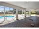 Relaxing pool area with an screened enclosure, and a large deck and a view of the backyard at 949 Shadow Oaks Rd, Kissimmee, FL 34744