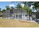 A screened-in pool offers a refreshing retreat in the backyard of this cozy home at 949 Shadow Oaks Rd, Kissimmee, FL 34744