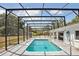 Relax in the screened pool area, offering a private and refreshing outdoor retreat at 949 Shadow Oaks Rd, Kissimmee, FL 34744