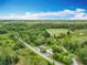 A high aerial view showing the lot size as well as the road on which the home sits at 9506 Number Two Rd, Howey In The Hills, FL 34737