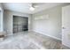 Bedroom featuring tile floors, a closet, and a horizontally oriented window at 9506 Number Two Rd, Howey In The Hills, FL 34737