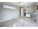 A bedroom with tile floors and a long window at 9506 Number Two Rd, Howey In The Hills, FL 34737