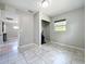 Bedroom features tile flooring, closet, and a window for natural light at 9506 Number Two Rd, Howey In The Hills, FL 34737