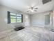 Inviting, open-concept living space with modern tile floors and great natural light at 9506 Number Two Rd, Howey In The Hills, FL 34737
