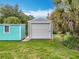 Two storage sheds and lush green grass add functionality and charm to the property at 9506 Number Two Rd, Howey In The Hills, FL 34737
