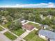 Aerial view of home with fenced backyard, mature trees, and neighborhood at 970 Courtland Blvd, Deltona, FL 32738