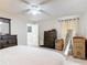 Bright bedroom boasts natural light, a ceiling fan, and neutral tones, providing a versatile space at 970 Courtland Blvd, Deltona, FL 32738