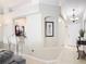 Open-concept living area with breakfast bar, tile flooring and neutral colors at 970 Courtland Blvd, Deltona, FL 32738