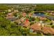 Aerial view of a single Gathering home with a pool and a pond view from the back of the property at 9852 Caroline Park Dr, Orlando, FL 32832