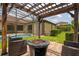Outdoor living space features a brick patio, fire pit, and screened in lanai with a pool at 9852 Caroline Park Dr, Orlando, FL 32832