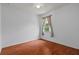 Empty bedroom featuring laminate floors, a window with curtains, and a ceiling fan at 9852 Caroline Park Dr, Orlando, FL 32832