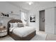 Bedroom with a bed, window, and a closet. Decorated with pictures and decor at 9852 Caroline Park Dr, Orlando, FL 32832
