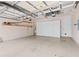 Spacious garage with high ceilings, ample storage shelves, and room for multiple vehicles at 9852 Caroline Park Dr, Orlando, FL 32832