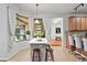 Kitchen with an island, eat in breakfast area, tile floors, and lots of natural light at 9852 Caroline Park Dr, Orlando, FL 32832