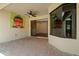 Covered patio featuring beautiful brick pavers, fan and art, offering a great space for relaxation at 9852 Caroline Park Dr, Orlando, FL 32832